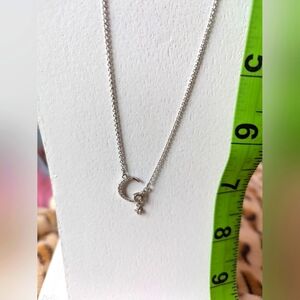 Moon and Star silver necklace with rhinestone detail. Adjustable